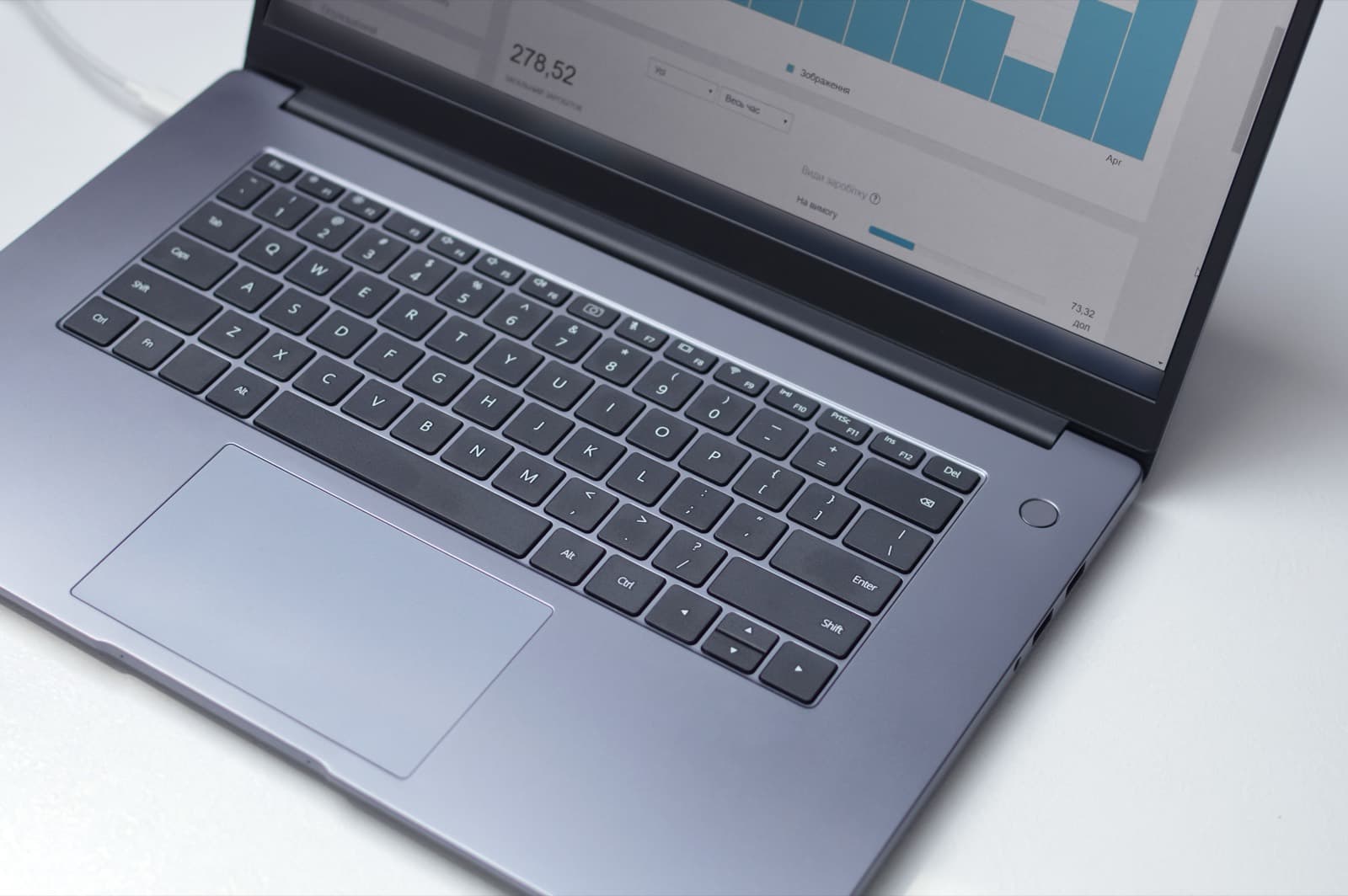 A laptop displaying a data conversion interface on an office desk