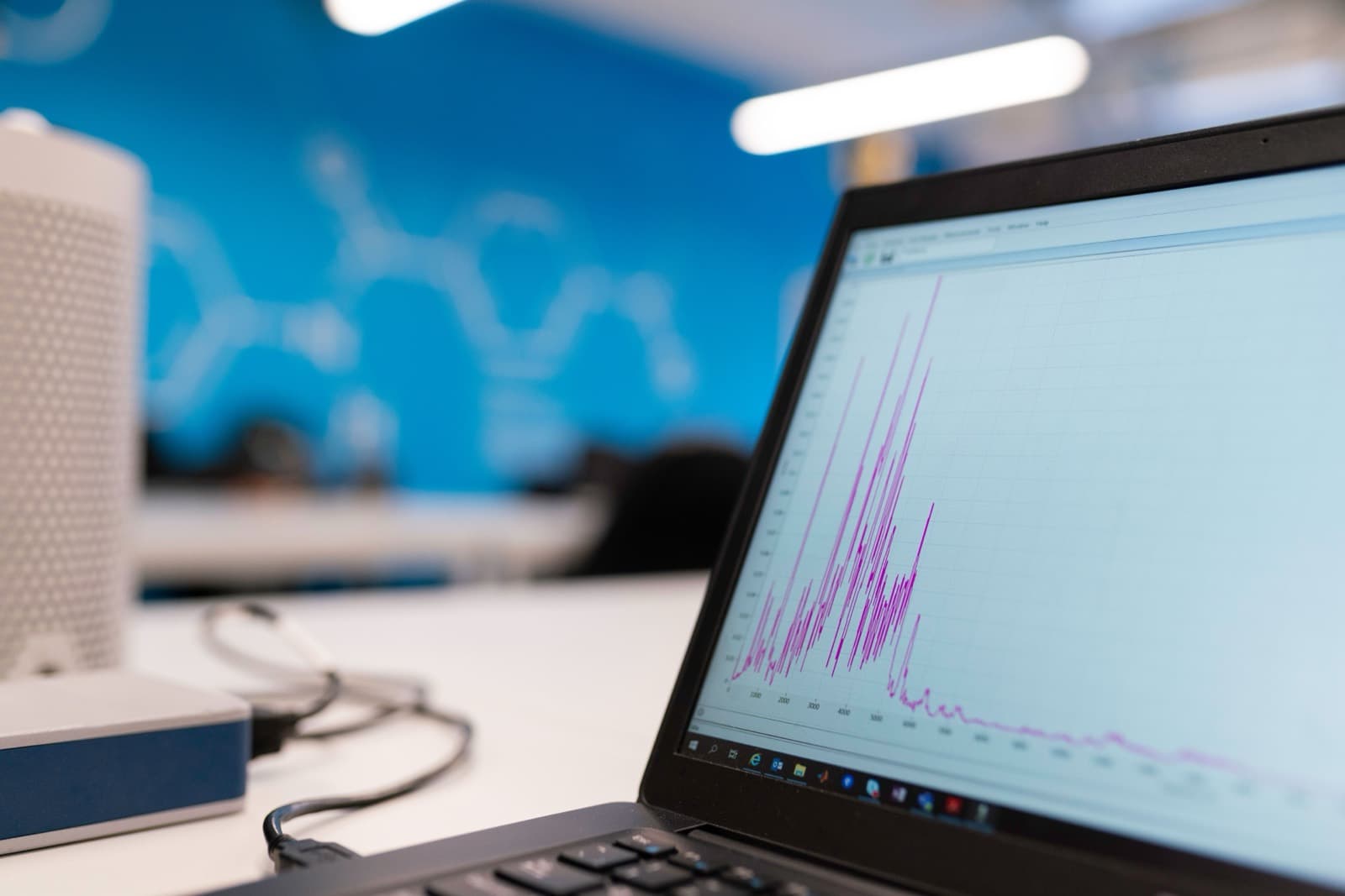 A laptop screen displaying a data graph, representing PDF-to-Excel conversion